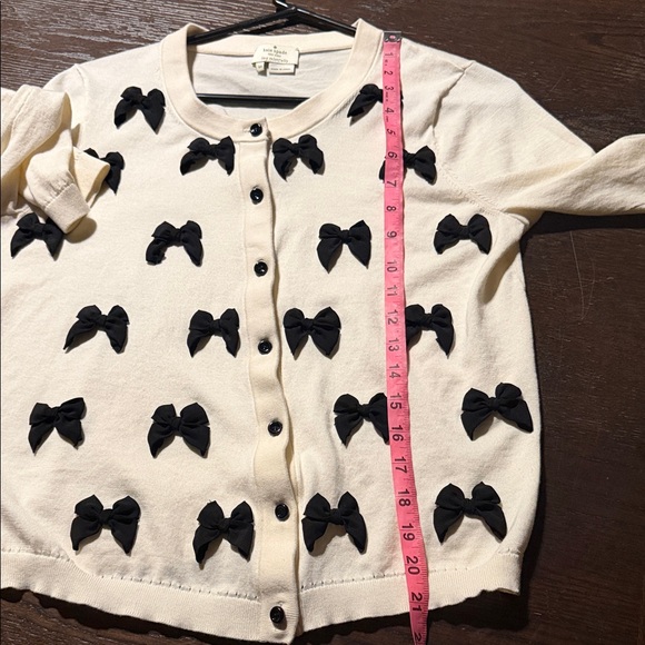 Kate Spade Ruthie Bow Cardigan in cream with black bows. - Picture 7 of 8
